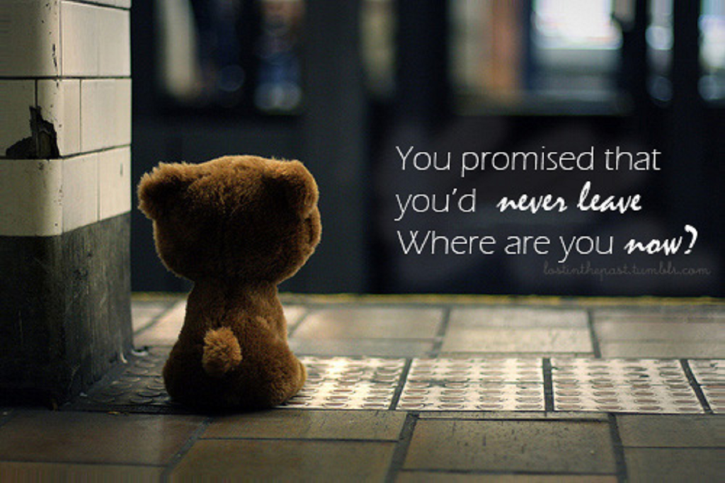 A little teddy bear sitting on a hallway floor, waiting for someone. The text next to him says, "You promised you'd never leave. Where are you now?"